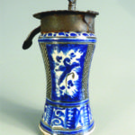 An 18th C. Mexican majolica albarello jar, blue and white, mounted with an iron lock with original key, 9" high.
