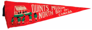 1930s pennant of the Dionne Quints playing in their front yard