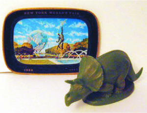 Wax Sinclair Oil dinosaur from the 1964-65 New York World's Fair and a small tray given away at the USS Steel Building. The image on the tray is of the giant Unisphere which was the symbol of the fair.