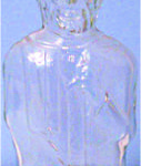 Figural bottle of Abe Lincoln. Once the liquid was finished there was a hole in his hat to turn it into a bank.